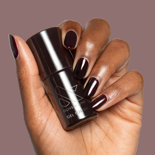 Shop Til You Drop Gel on medium-length nails in a deep vampy red for a chic, long-lasting manicure by Olive and June