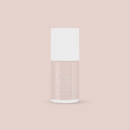 Bottle of CDJ gel polish in a cool creamy neutral shade by Olive and June for long-lasting at-home manicures