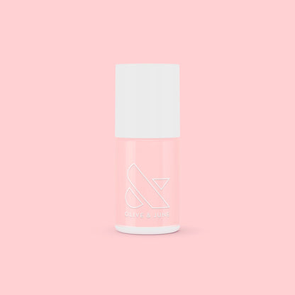 SCL nail polish bottle in soft bubblegum pink shade against a matching light pink background