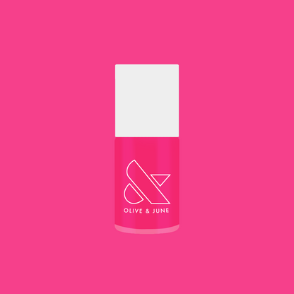 Bright hot pink Love All nail polish bottle by Olive and June for quick-dry, long-lasting at-home manicure looks