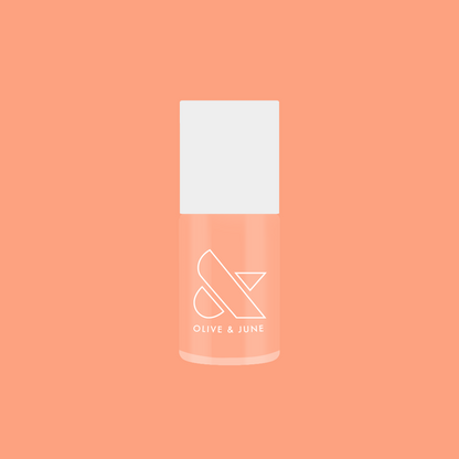 Bottle of It’s Serving Melon Cocktails nail polish in soft pastel melon shade for fresh, long-lasting at home manicure looks