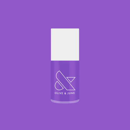 Bottle of Tennis Skirt nail polish by Olive and June in bright purple for quick-dry, long-lasting at-home mani looks