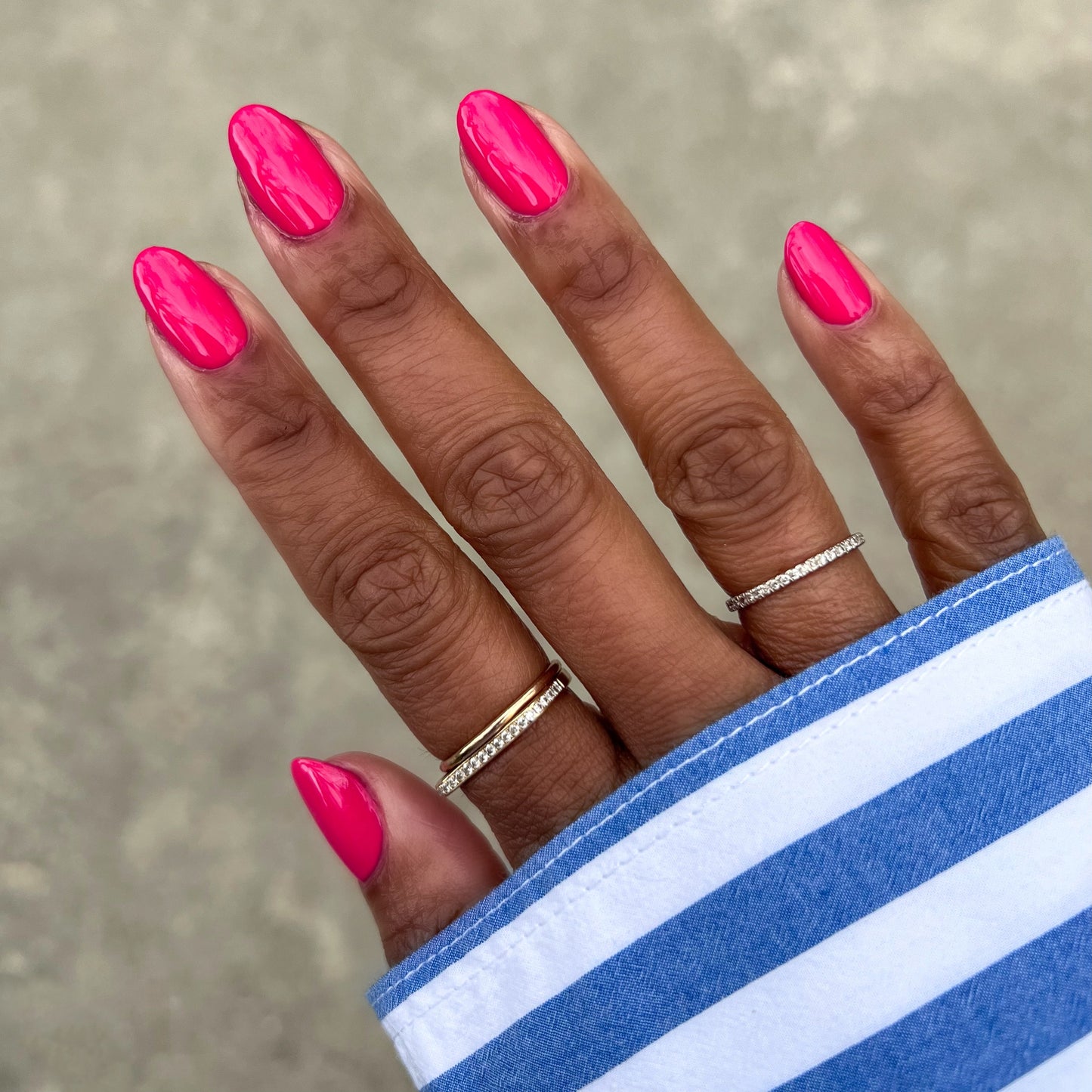Diner Date bright hot pink gel polish on natural nails with a smooth glossy finish for a vibrant manicure