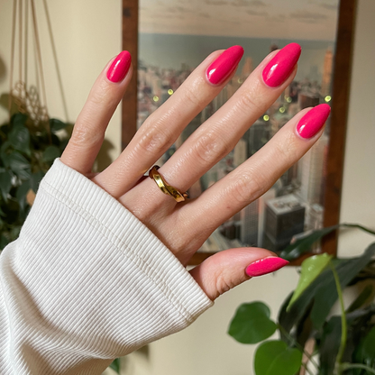 Diner Date bright hot pink gel polish on almond-shaped nails with a glossy finish for a quick at-home mani