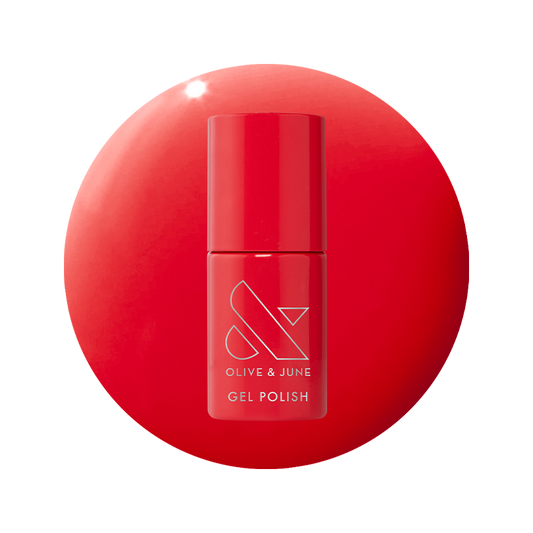 Bottle of Field Day - Gel polish in vibrant watermelon red shade on matching red background