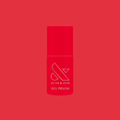 Bottle of Field Day - Gel polish in vibrant watermelon red shade on solid matching red background