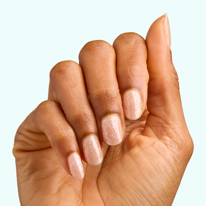 Hand with nails coated in sparkly sheer finish using DIAMONDS ARE A MANI’S BEST FRIEND Gel for a lasting manicure