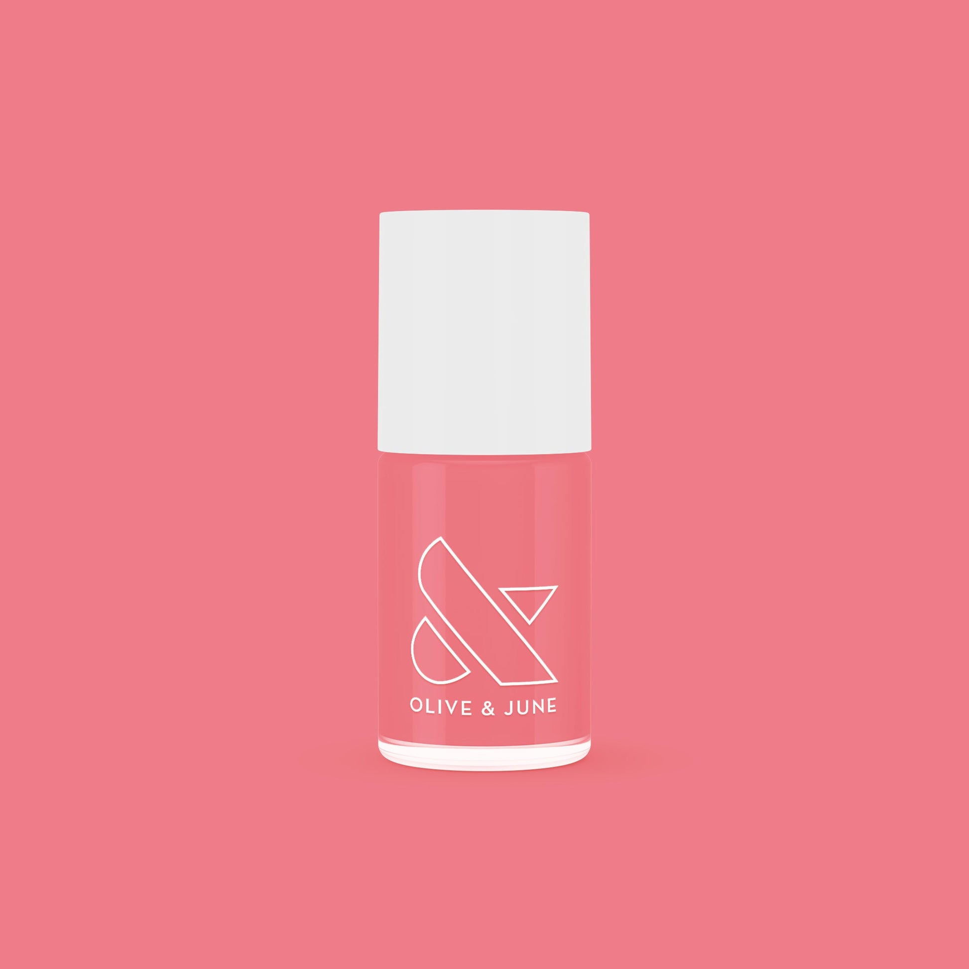 Bottle of Stinson Sunset gel polish by Olive and June in a peachy-pink coral shade on a matching background