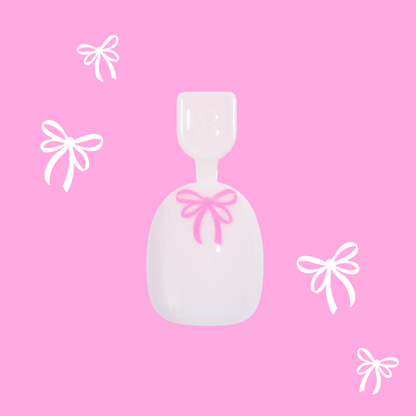 Pink Everything Please - Pressies | Extra Short Short | Round showing baby pink press-on nail with bright pink bow design on pink background