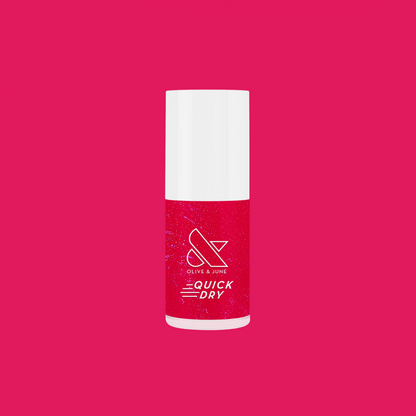 Bottle of Olive and June Berries quick dry gel polish in vibrant berry-pink shade on bright pink background