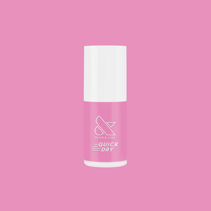 Bottle of Taffy quick dry gel polish in bright pink by Olive and June on a solid pink background