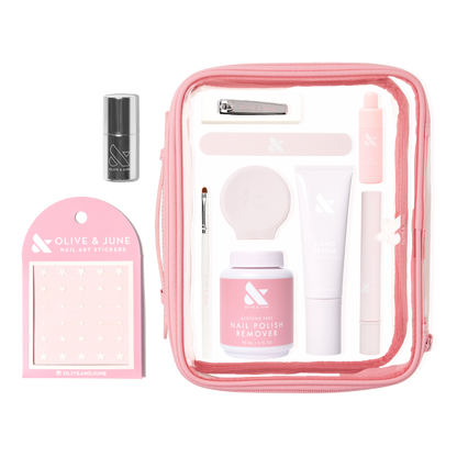 The Mani Weekender - 1 Polish kit with nail polish remover, hand serum, nail clipper, stickers, and tools in pink pouch