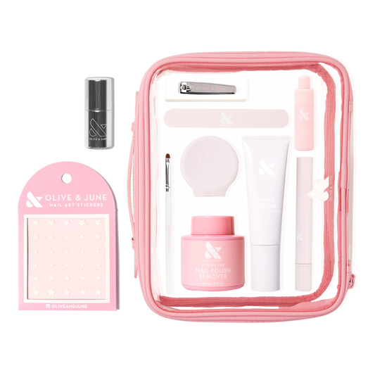 The Mani Weekender - 1 Polish kit with nail polish remover, hand serum, nail clipper, stickers, and clear pink pouch