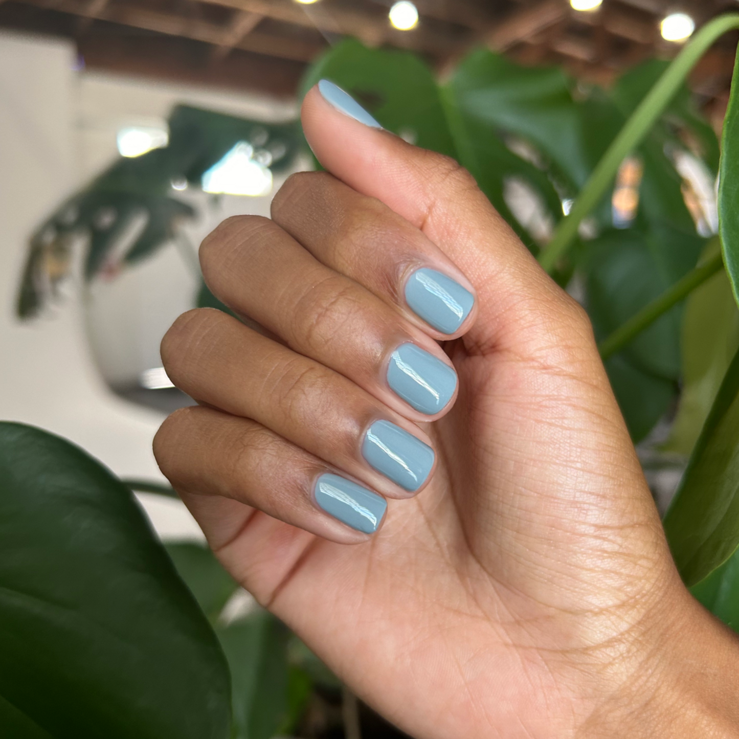 Vintage - Gel shown on hand with smooth vintage denim blue nails for a stylish and long-lasting gel manicure by Olive and June