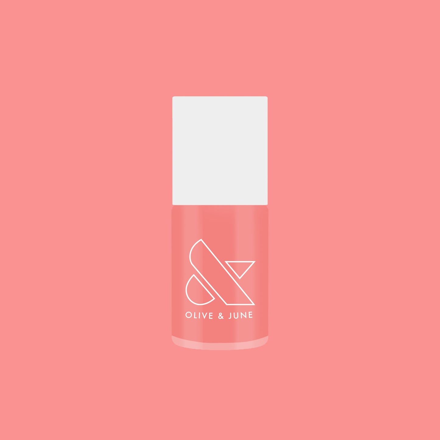 Bottle of Carrot Juice gel polish by Olive and June in a vibrant carrot orange shade on coral background