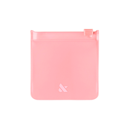 Mini Pouch in soft pink with zip-top closure, perfect for storing press-on nails and manicure essentials.